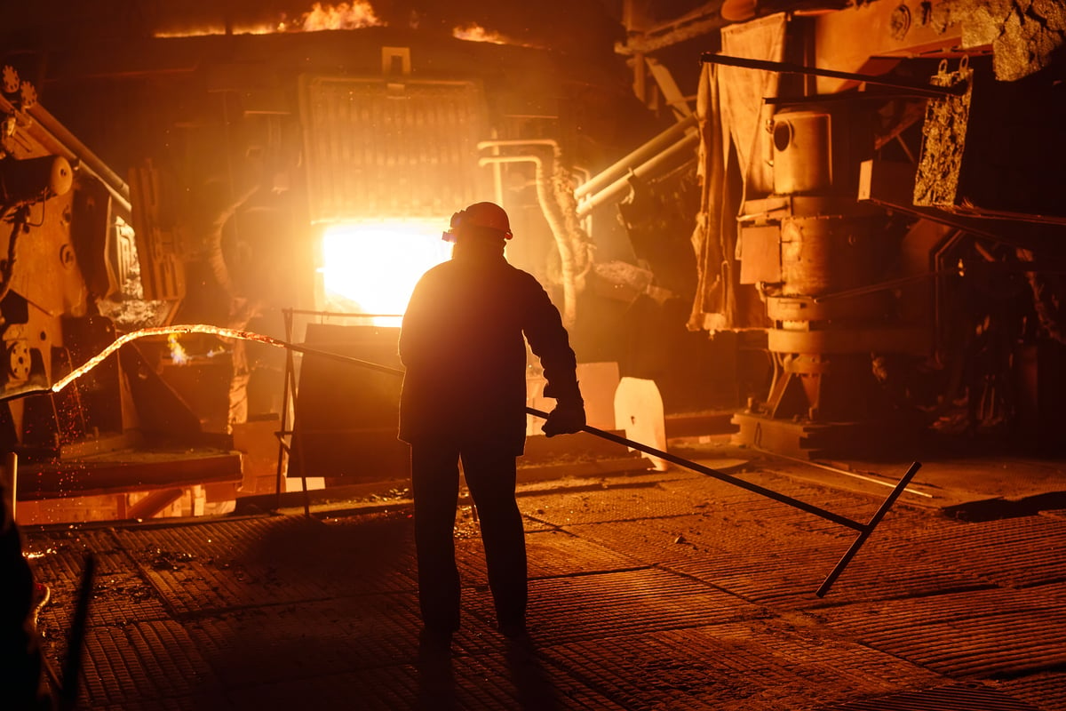 Furnace Worker taking steel slag sample